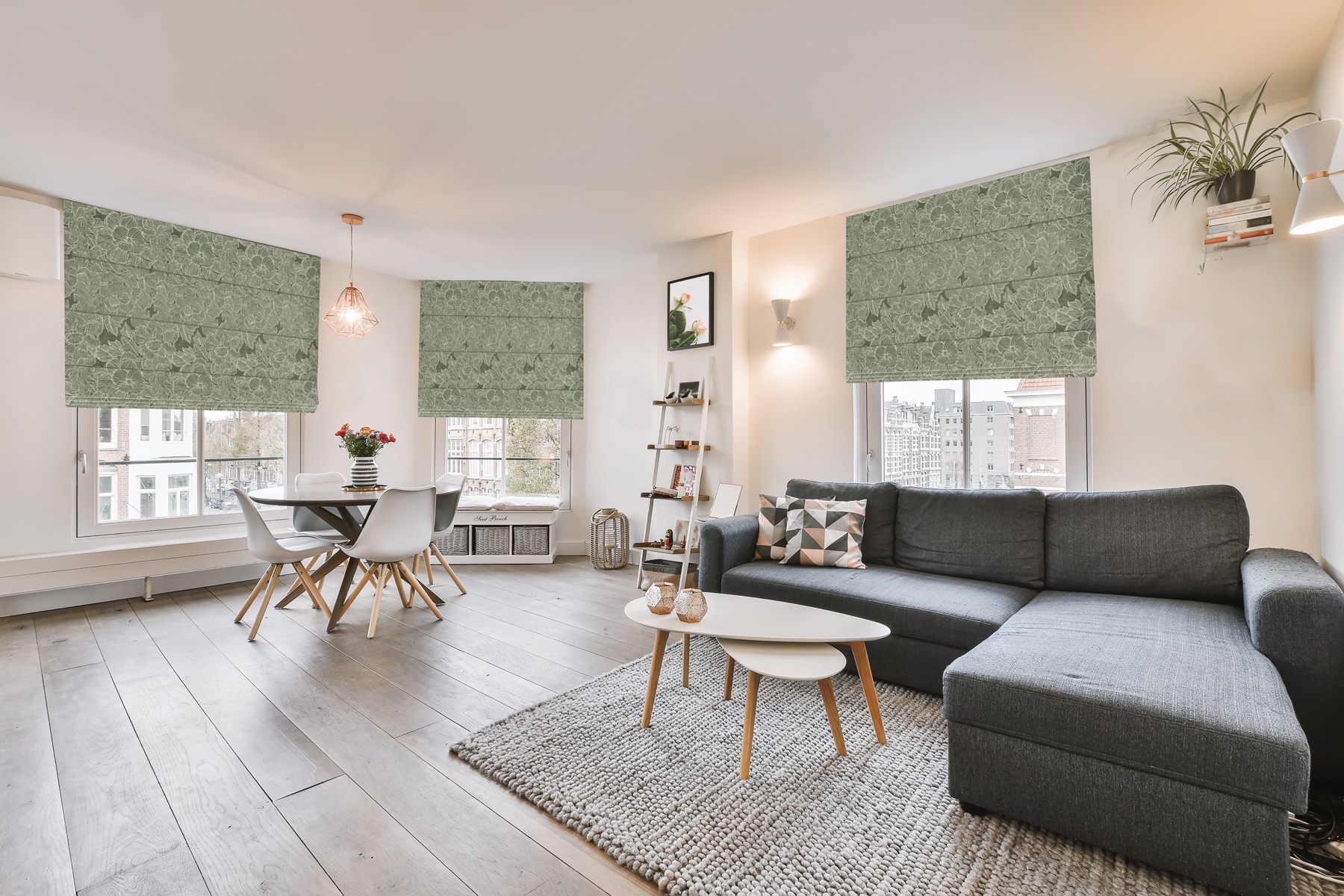 Norman roman shades in a dining and living area